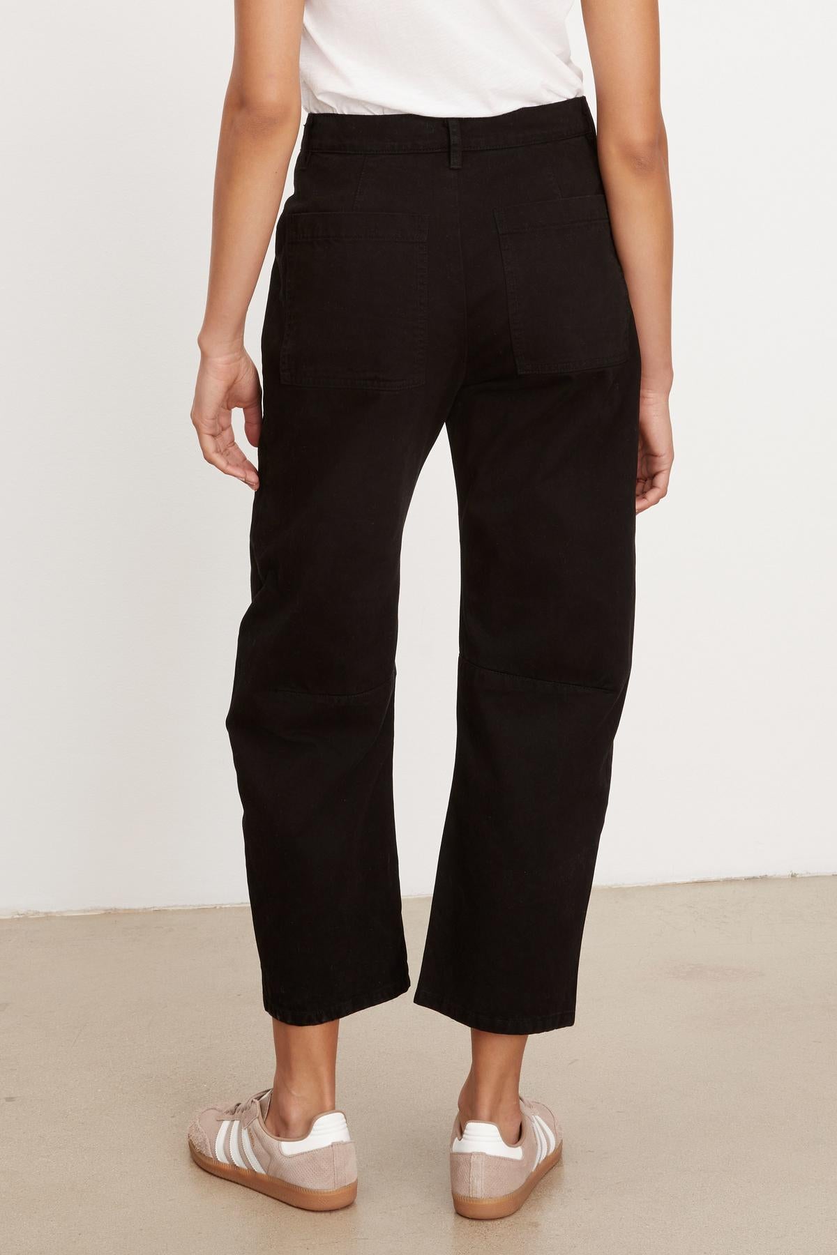 The back view of a woman wearing Velvet by Graham & Spencer BRYLIE SANDED TWILL UTILITY PANT with patch pockets.-35955673759937
