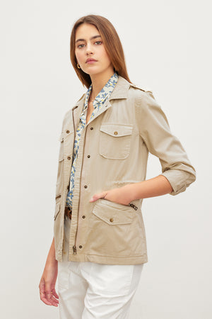A woman wearing a Velvet by Graham & Spencer RUBY LIGHT-WEIGHT ARMY JACKET.