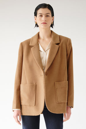 The model is wearing an oversized Velvet by Jenny Graham Alamos blazer.
