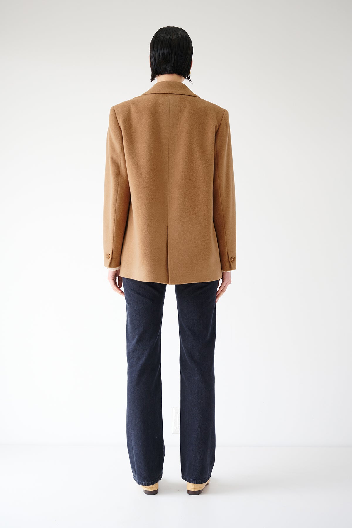 The back view of a man wearing an oversized Velvet by Jenny Graham Alamos Blazer.