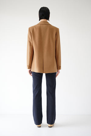 The back view of a man wearing an oversized Velvet by Jenny Graham Alamos Blazer.