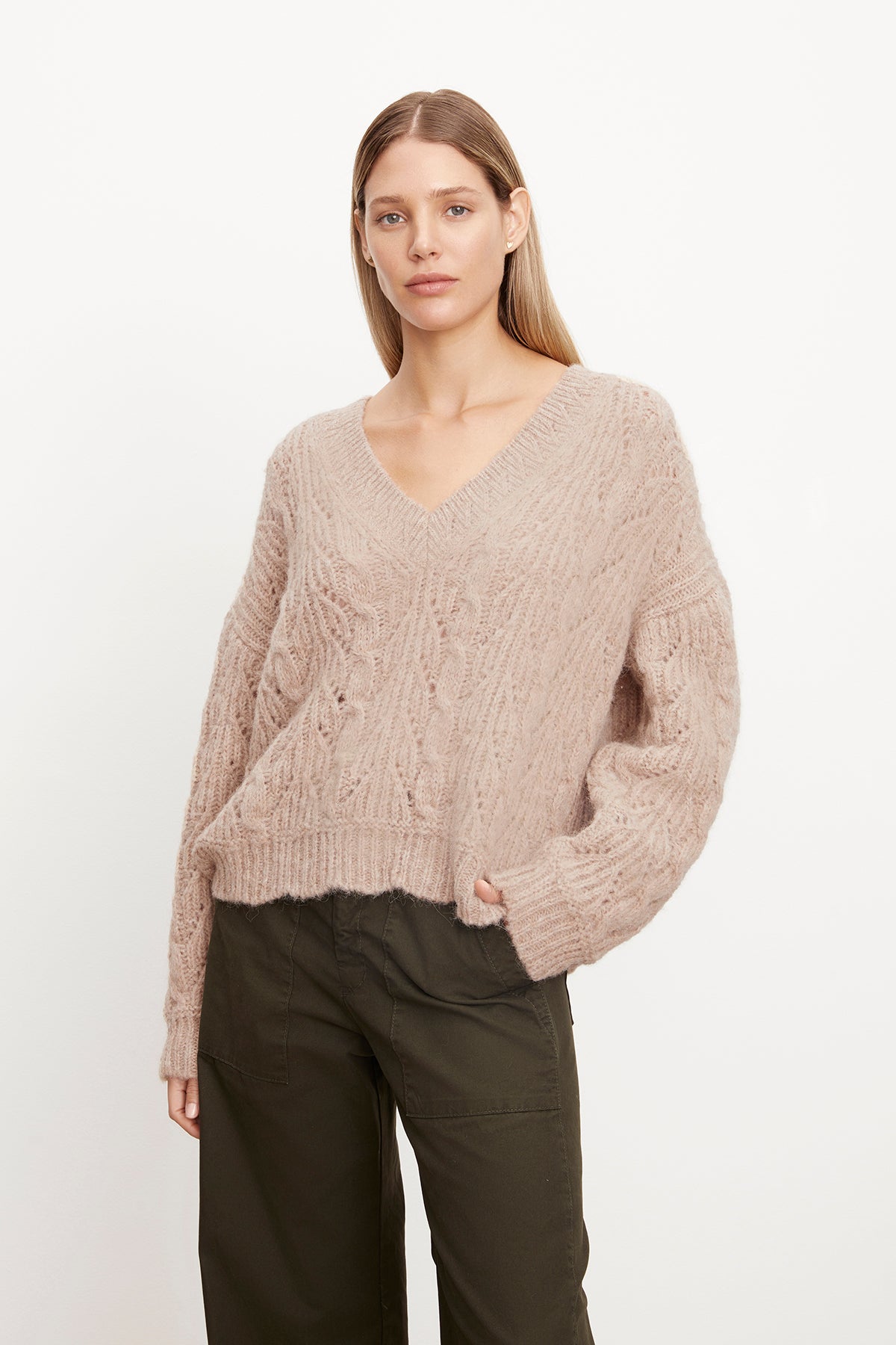 The model is wearing a Velvet by Graham & Spencer SADE ALPACA BLEND V-NECK SWEATER.