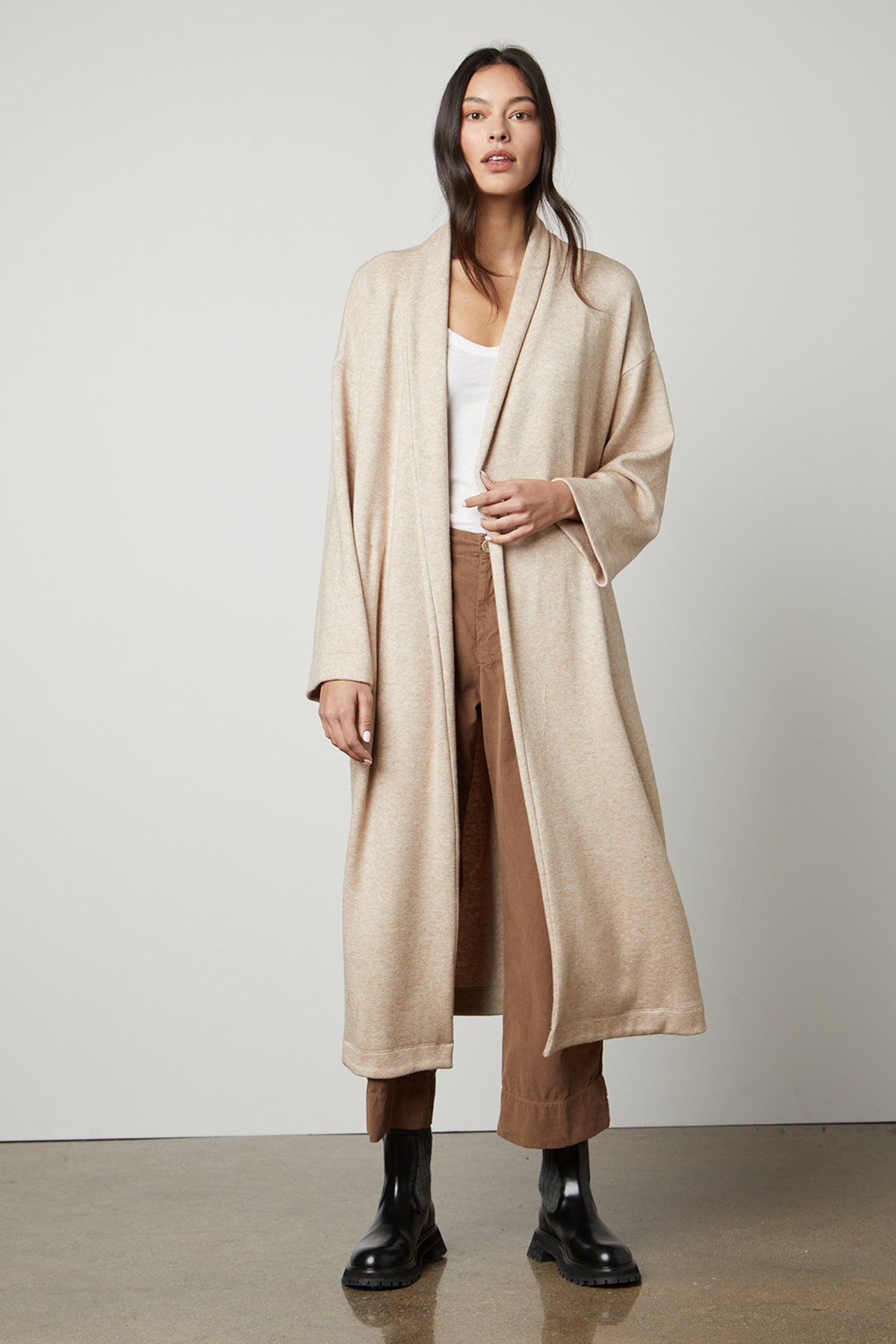 A model wearing the Velvet by Graham & Spencer PATRICIA DOUBLE KNIT DUSTER CARDIGAN.