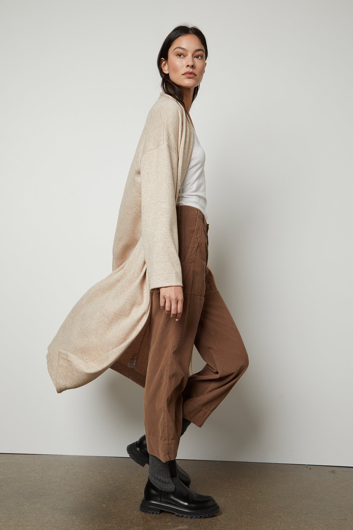The model is wearing a Velvet by Graham & Spencer PATRICIA DOUBLE KNIT DUSTER CARDIGAN.