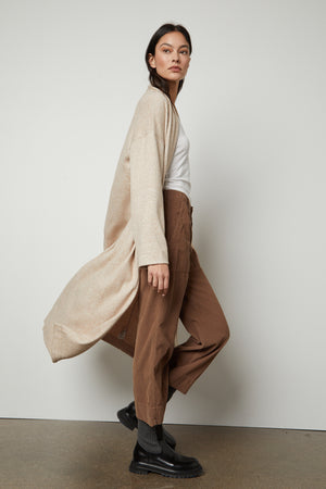 The model is wearing a Velvet by Graham & Spencer PATRICIA DOUBLE KNIT DUSTER CARDIGAN.