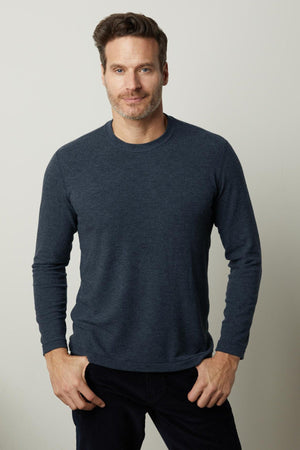 A man wearing a Velvet by Graham & Spencer BECKER COZY JERSEY CREW long sleeve t-shirt.