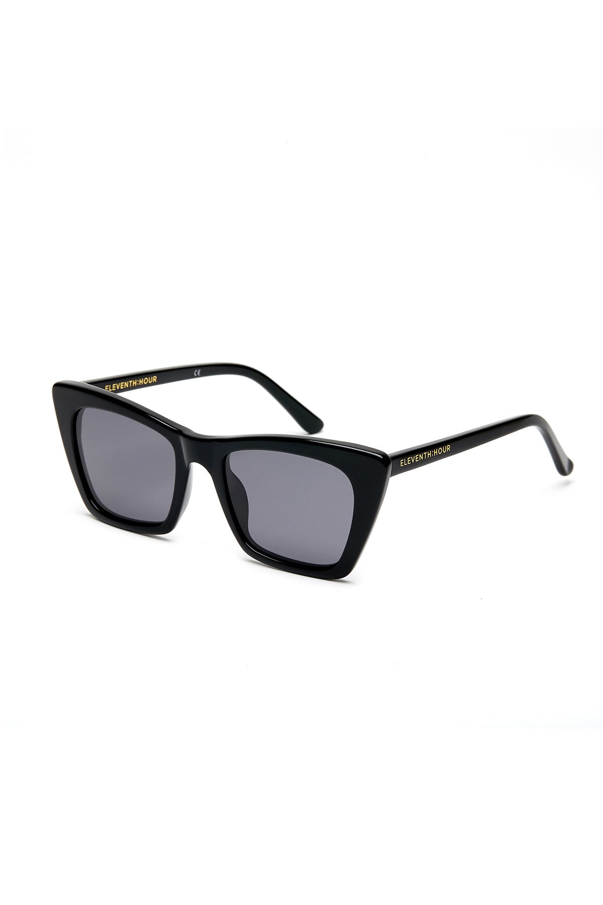 Black rectangular ESSENTIAL CLASSIC SUNGLASSES BY ELEVENTH HOUR with dark lenses and thin arms. The brand name, Eleventh Hour, is written on the arms in gold.-37468464775361
