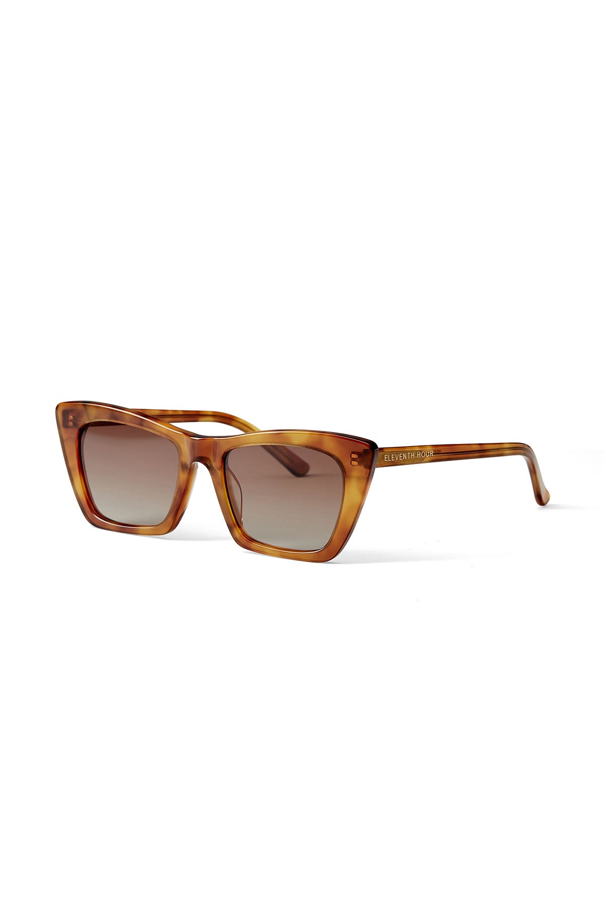 A pair of ESSENTIAL CLASSIC SUNGLASSES BY ELEVENTH HOUR with brown gradient lenses and Eleventh Hour lettering on the side of the frame.-37468464709825