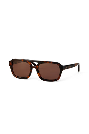 Rectangular, brown-tinted LATE CHECKOUT SUNGLASSES BY ELEVENTH HOUR with a tortoise shell frame against a white background.