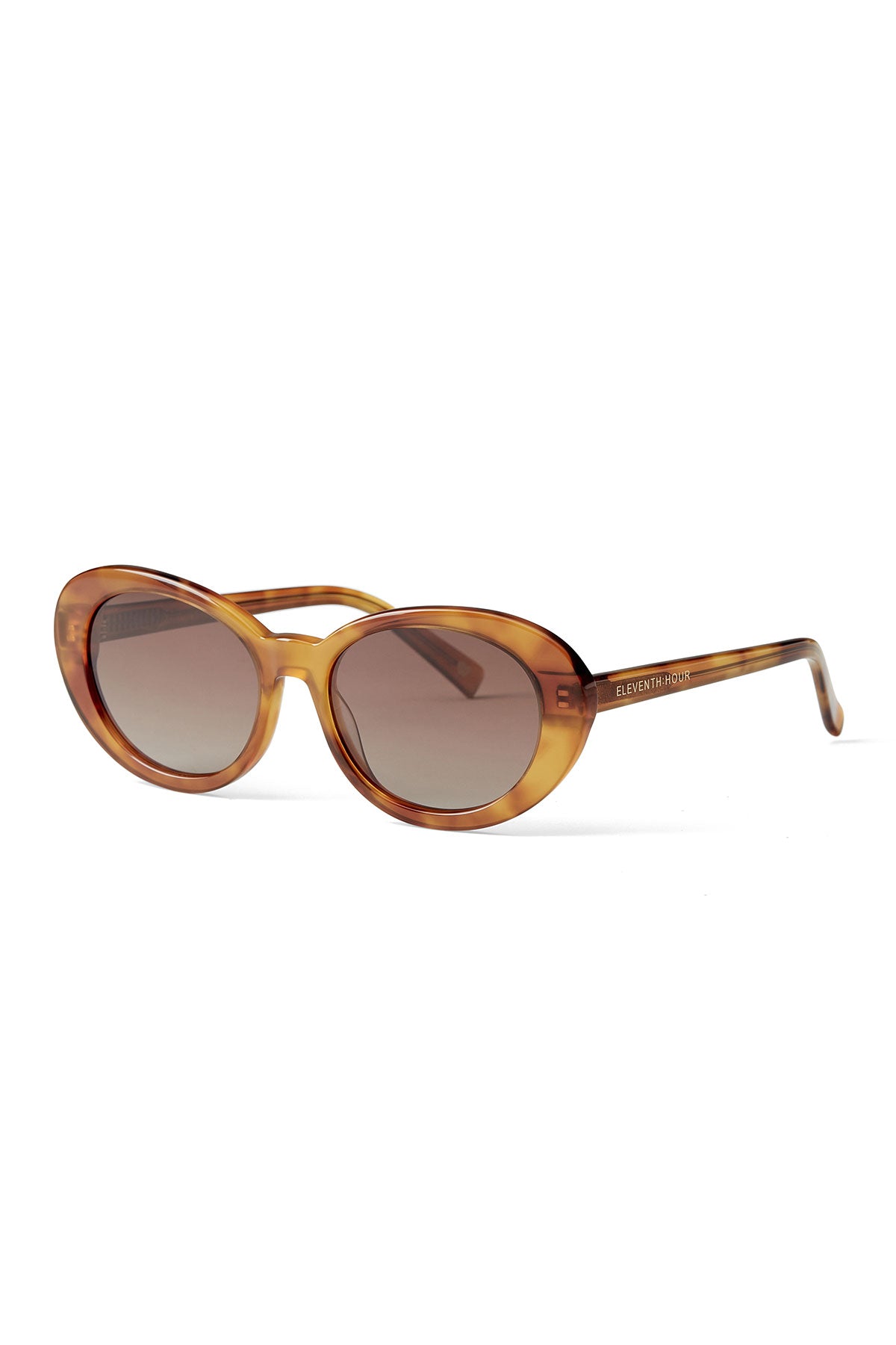 The DOLCE SUNGLASSES BY ELEVENTH HOUR from Eleventh Hour feature brown oval frames, gradient tinted lenses, and slightly curved arms, displayed on a white background.-39219256852673