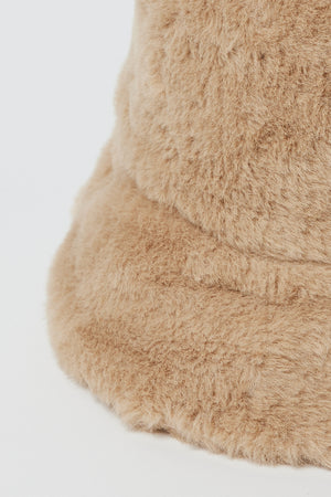 A Velvet by Graham & Spencer FAUX FUR BUCKET HAT with a faux fur lining.