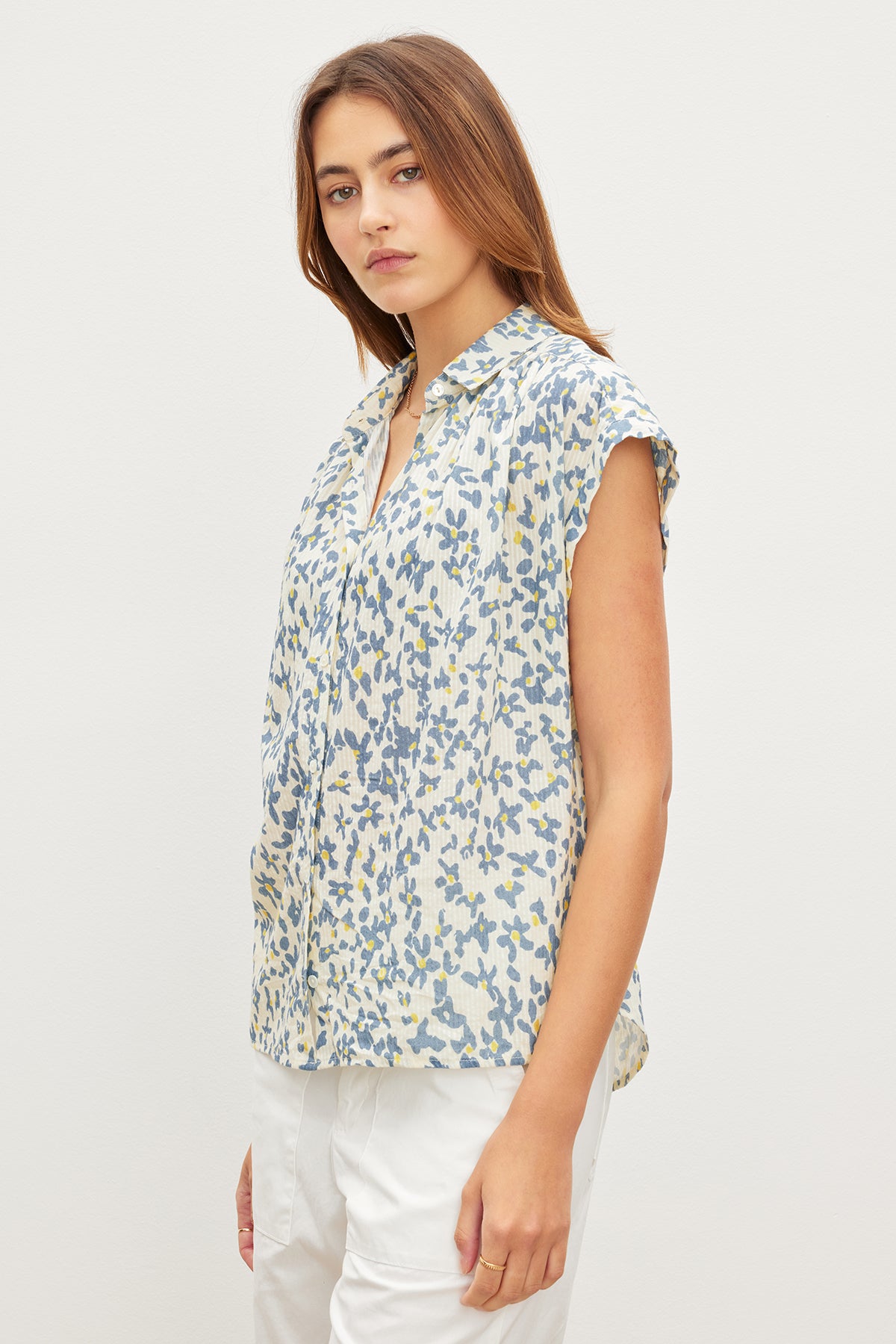A woman in a Velvet by Graham & Spencer white shirt with subtle stripe details.-35967566282945