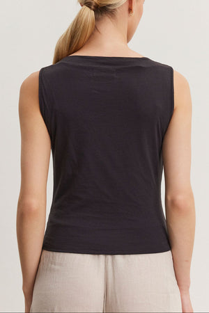 Woman wearing an Emilia tank top by Velvet by Graham & Spencer, viewed from the back, with a ponytail hairstyle.