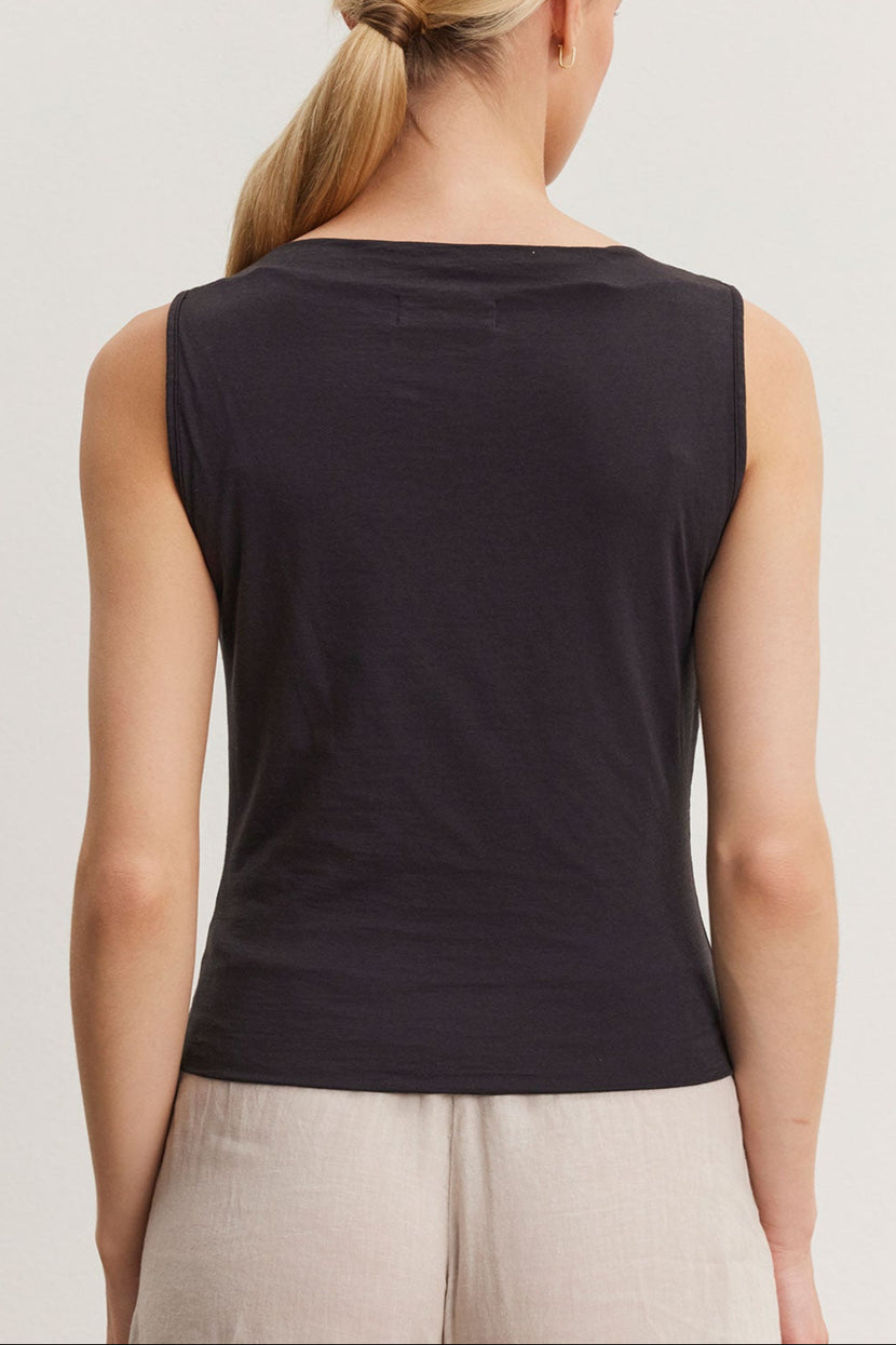 Woman wearing an Emilia tank top by Velvet by Graham & Spencer, viewed from the back, with a ponytail hairstyle.