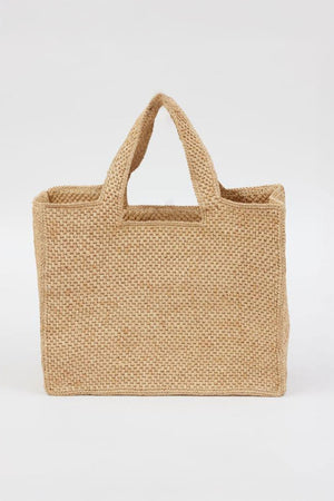 The LULU TOTE by Velvet by Graham & Spencer is a rectangular woven straw tote with two handles, displayed on a plain white background.