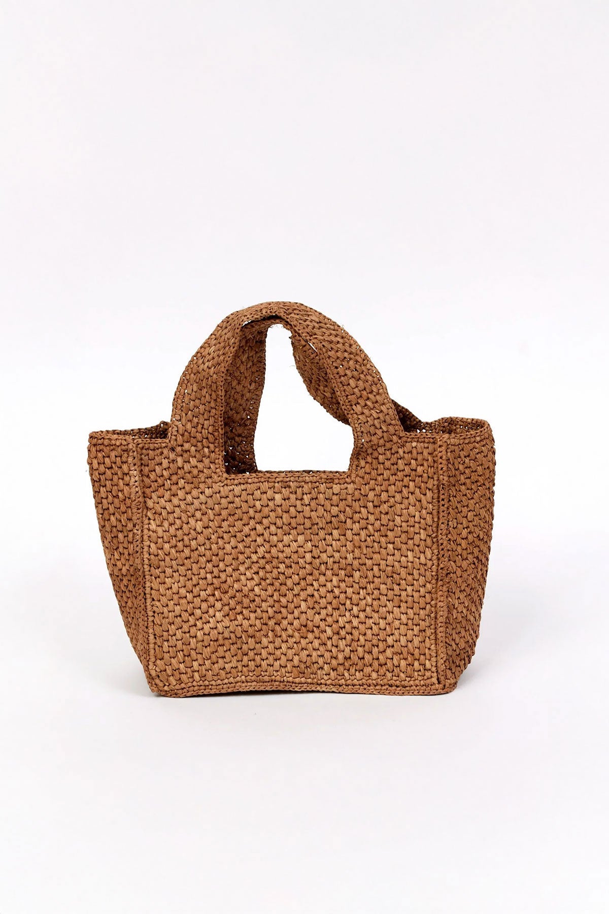 The MINI LULU TOTE by Velvet by Graham & Spencer is a brown woven handbag featuring two handles, shown against a plain white background.-38884405838017