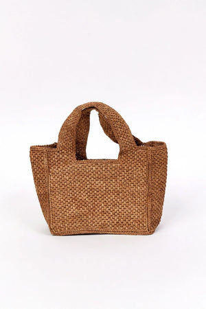The MINI LULU TOTE by Velvet by Graham & Spencer is a brown woven handbag featuring two handles, shown against a plain white background.