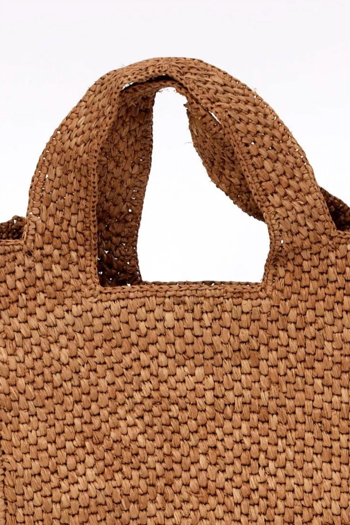 Close-up of the MINI LULU TOTE by Velvet by Graham & Spencer, featuring a brown woven design with two handles.-38884405870785