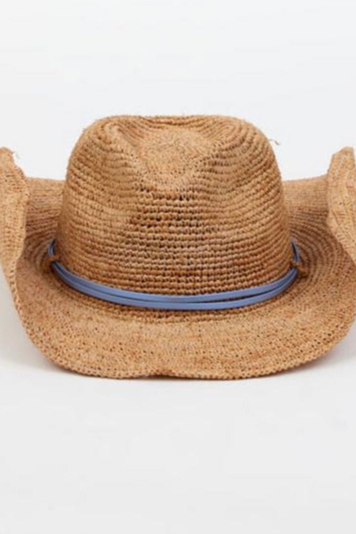 The RAFFIA CROCHET COWBOY HAT by Velvet by Graham & Spencer features a slightly creased crown and blue band, showcasing a classic western style against a plain white background.-38884431364289