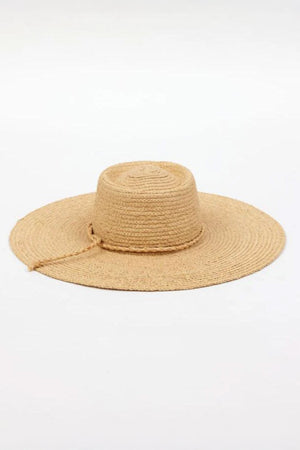 The SADIE SUN HAT by Velvet by Graham & Spencer is a natural-colored straw hat featuring a wide brim, round crown, and a small decorative string.