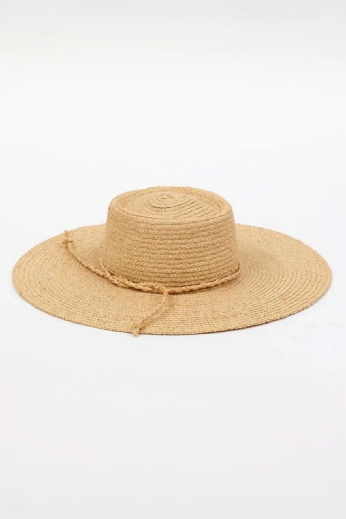 The SADIE SUN HAT by Velvet by Graham & Spencer is a wide-brimmed straw hat featuring a flat crown and a decorative string, set against a plain white background.