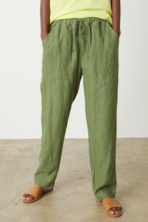 A woman wearing the Velvet by Graham & Spencer Cindy Heavy Linen Pant and a yellow t-shirt.
