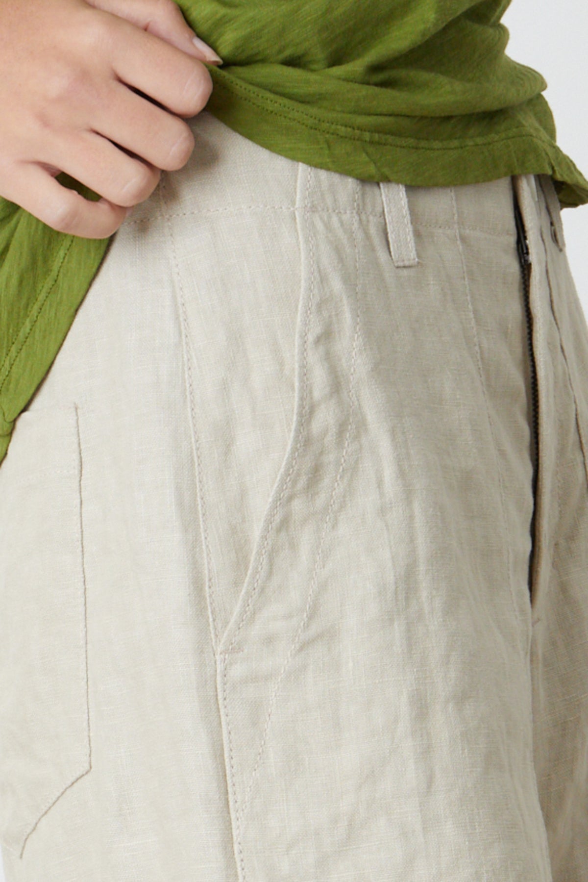 a woman wearing a green shirt and Velvet by Graham & Spencer's FALLON HEAVY LINEN SHORT.