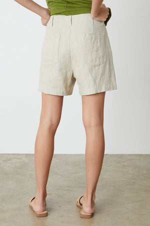 The back view of a woman wearing Velvet by Graham & Spencer's FALLON HEAVY LINEN SHORT.