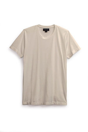 The HOWARD TEE by Velvet by Graham & Spencer is a plain, short-sleeved light beige Pima jersey crew neck laid flat on a white background, promising a perfect fit and timeless comfort.