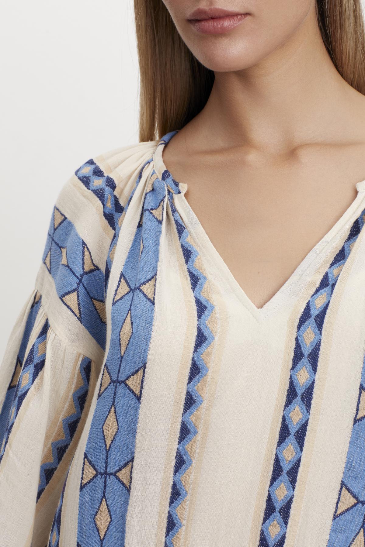 The model is wearing a Velvet by Graham & Spencer KALLY JACQUARD TIERED DRESS.-35702081519809