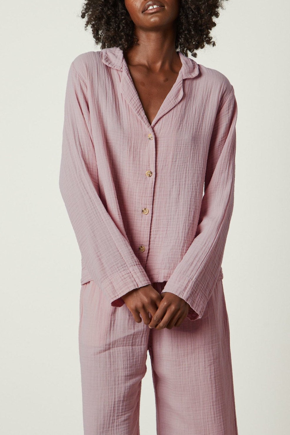 The model is wearing a pink Jenny Graham Home pajama shirt set.-26311366344897