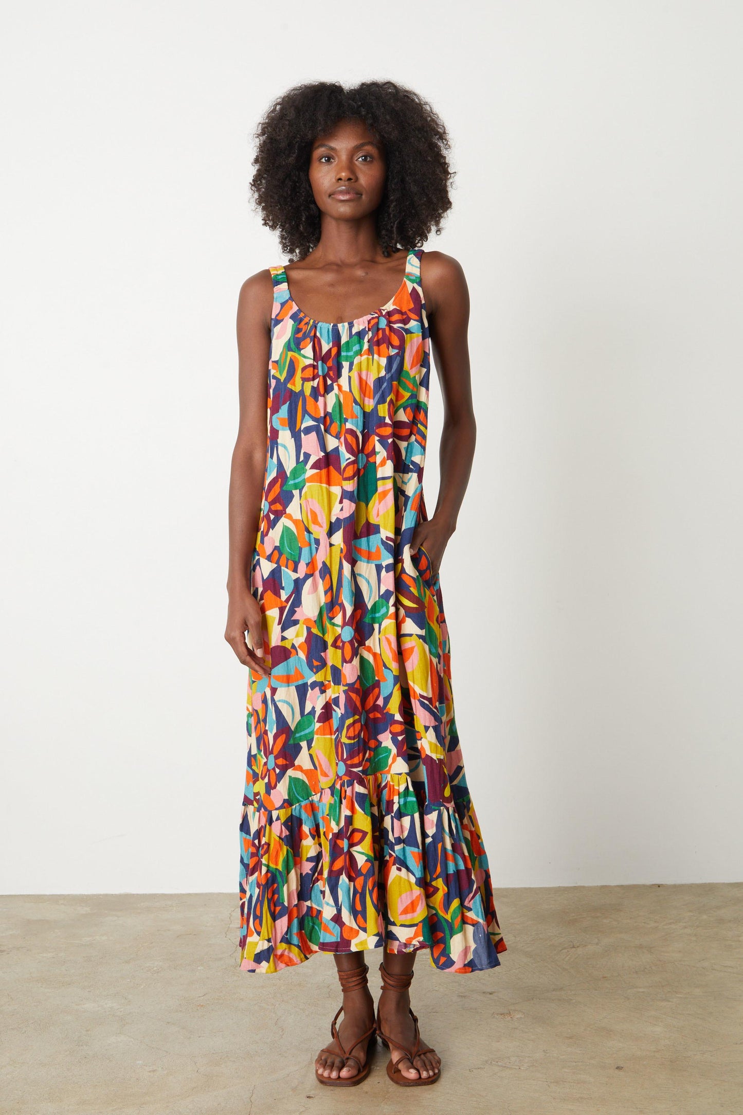 A woman wearing an ESTELLE PRINTED LINEN DRESS by Velvet by Graham & Spencer.-26774841688257