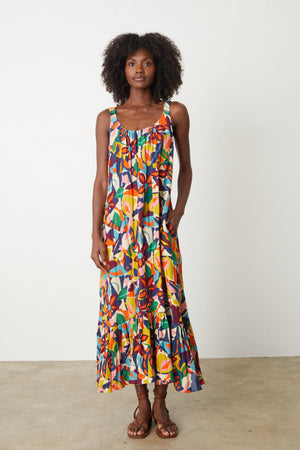 A woman wearing an ESTELLE PRINTED LINEN DRESS by Velvet by Graham & Spencer.