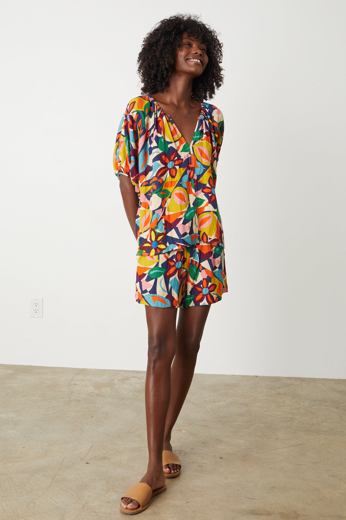 A woman wearing the Velvet by Graham & Spencer JOSIE PRINTED LINEN SHORT.