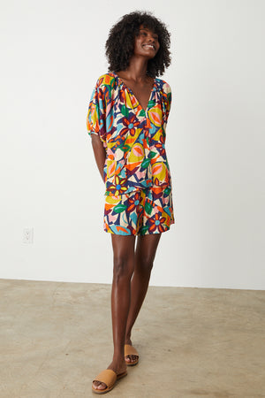 A woman wearing the Velvet by Graham & Spencer JOSIE PRINTED LINEN SHORT.