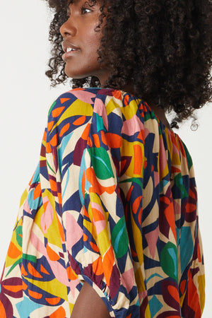The back view of a woman wearing a Velvet by Graham & Spencer's ROBIN PRINTED LINEN TOP detail