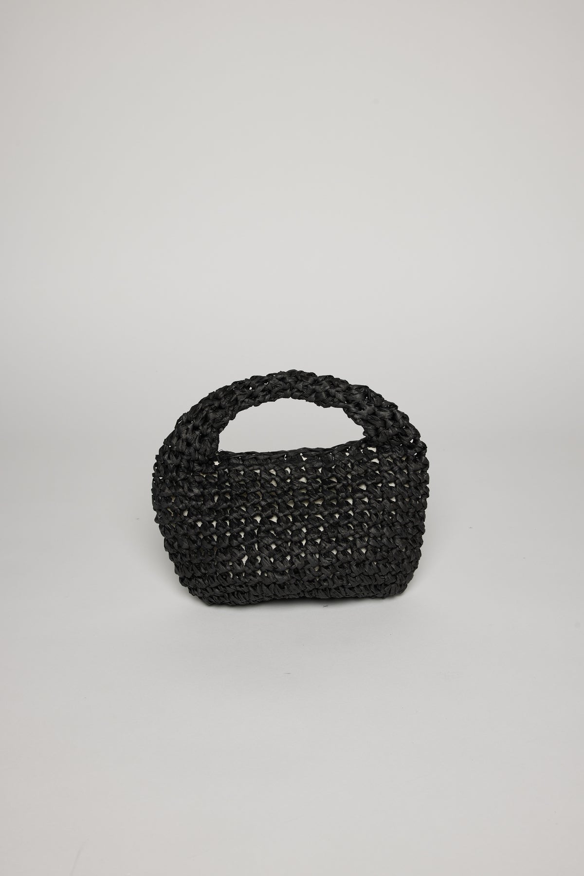 Compact black woven MICRO SLOUCH BAG by Velvet by Graham & Spencer on a white background.-36289711669441
