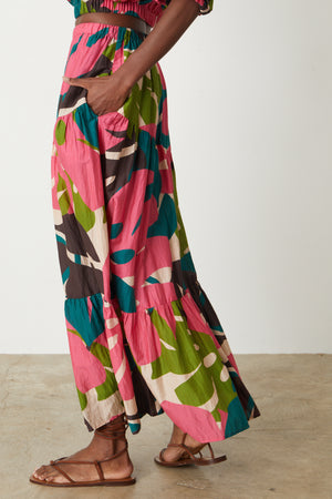 The view of a woman wearing Velvet by Graham & Spencer's LYDIA PRINTED TIERED SKIRT.