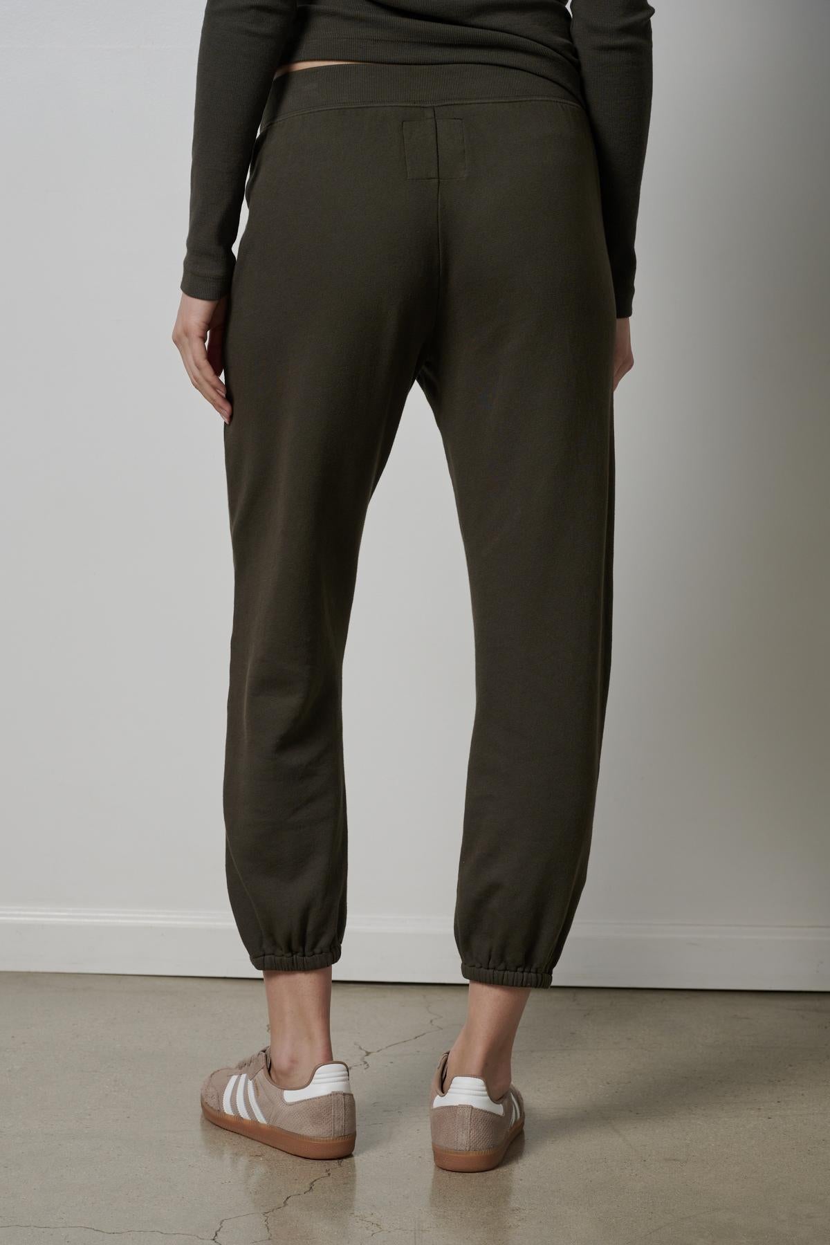 The back view of a woman wearing Velvet by Jenny Graham ZUMA SWEATPANTS.-26827763515585