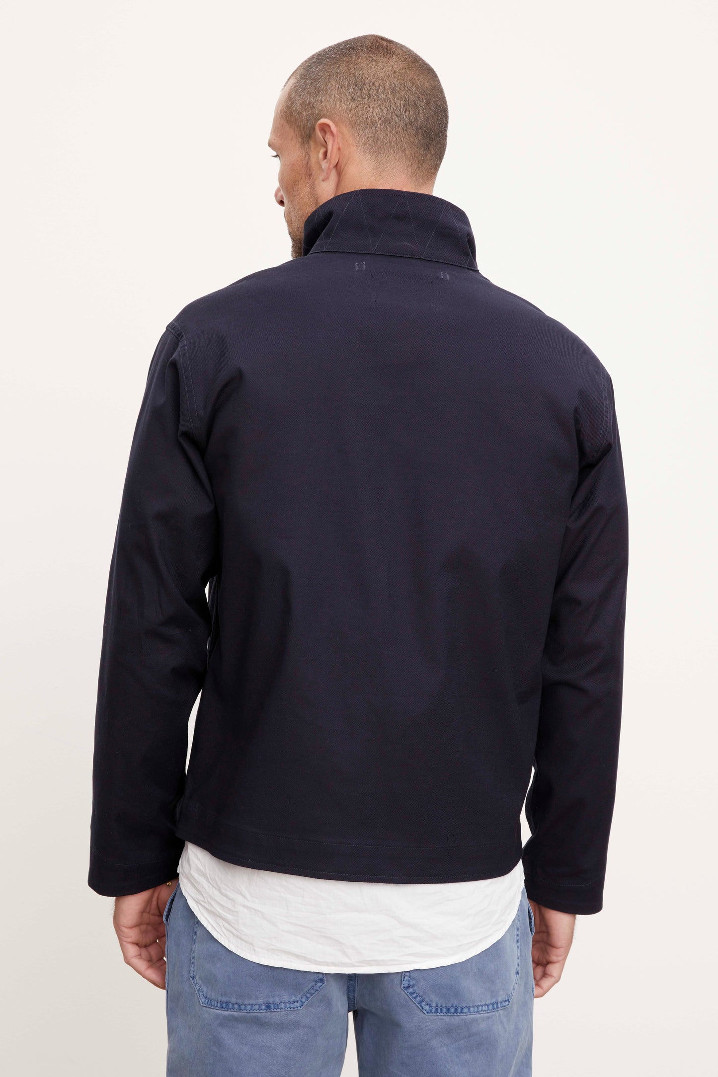 The back view of a man in a Velvet by Graham & Spencer MARLON ZIP-UP JACKET.-36212320927937