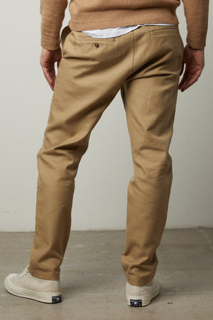 The back view of a man wearing Velvet by Graham & Spencer AIDEN COTTON TWILL PANT chino pants.