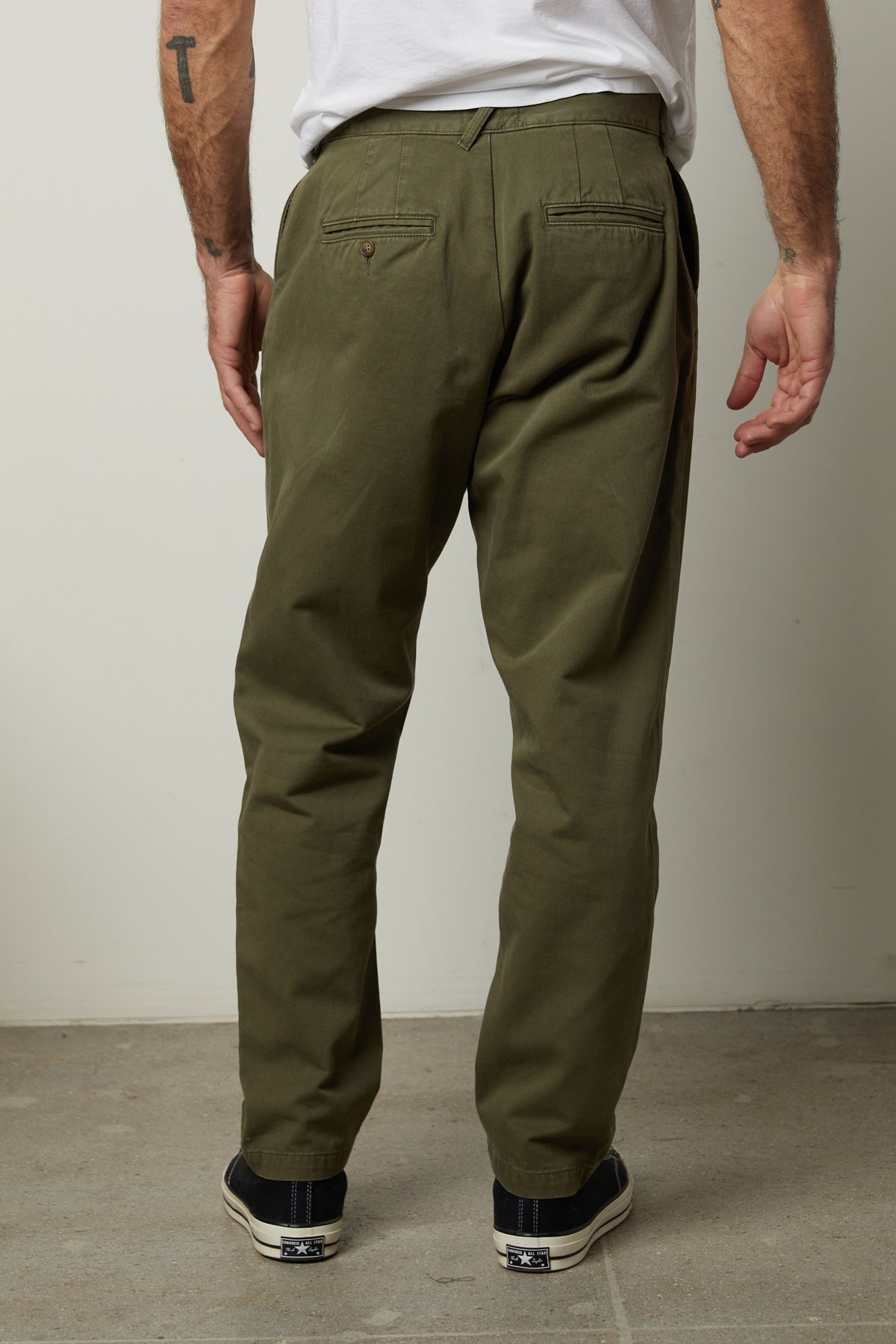 The back view of a man wearing Velvet by Graham & Spencer VINNY COTTON CANVAS PANT, straight-fit leg, olive green pants with 5 pocket styling.-26855321665729