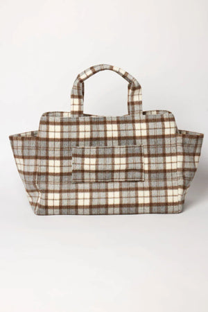 The PLAID TOTE by Velvet by Graham & Spencer features a rectangular shape, short handles, and a brown, gray, and white polyester wool blend plaid design, shown on a plain white background.