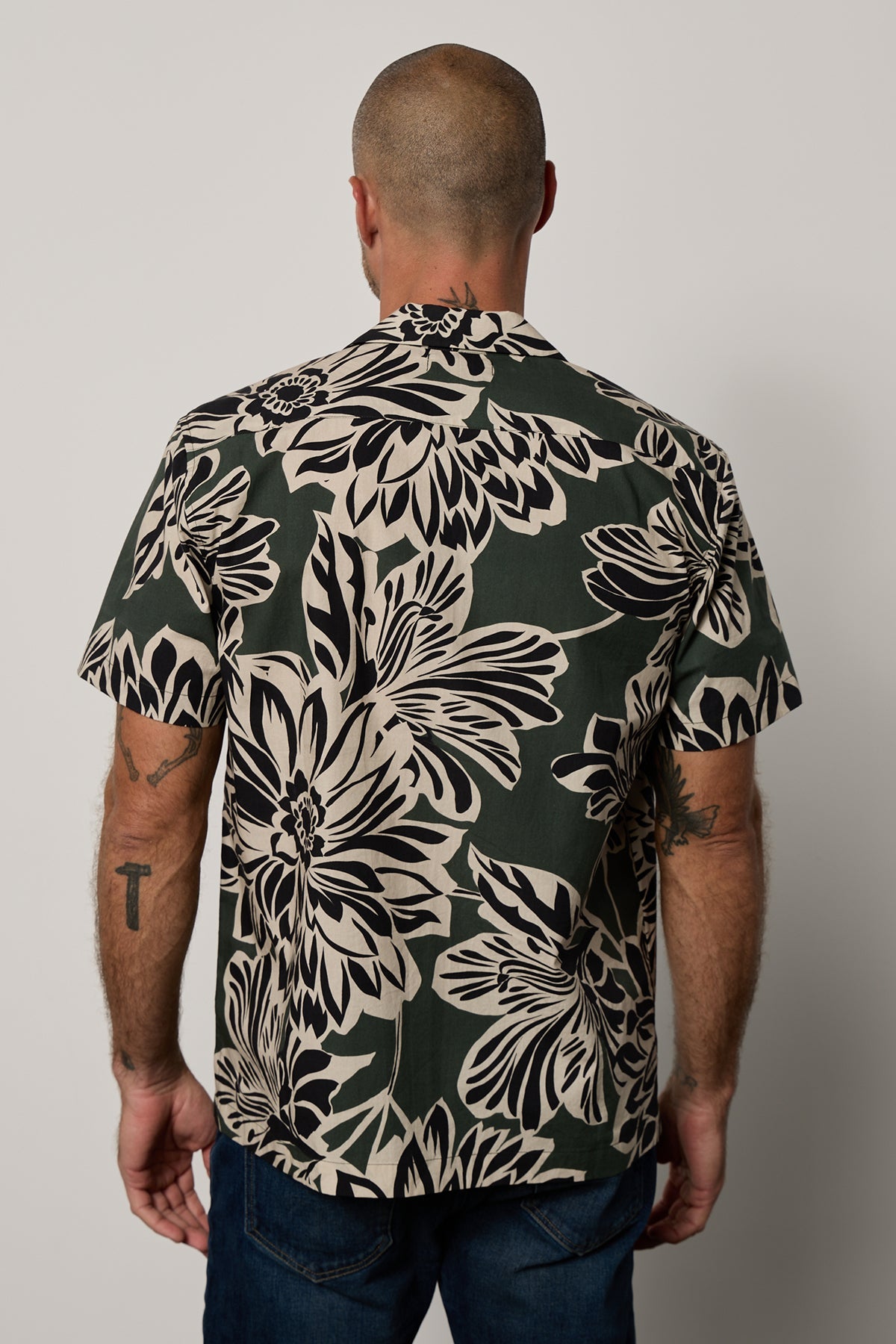 Iggy Button-Up Shirt in Catalina print with large bold black and cream abstract flower print on dark green background, with dark blue denim back-26801038786753