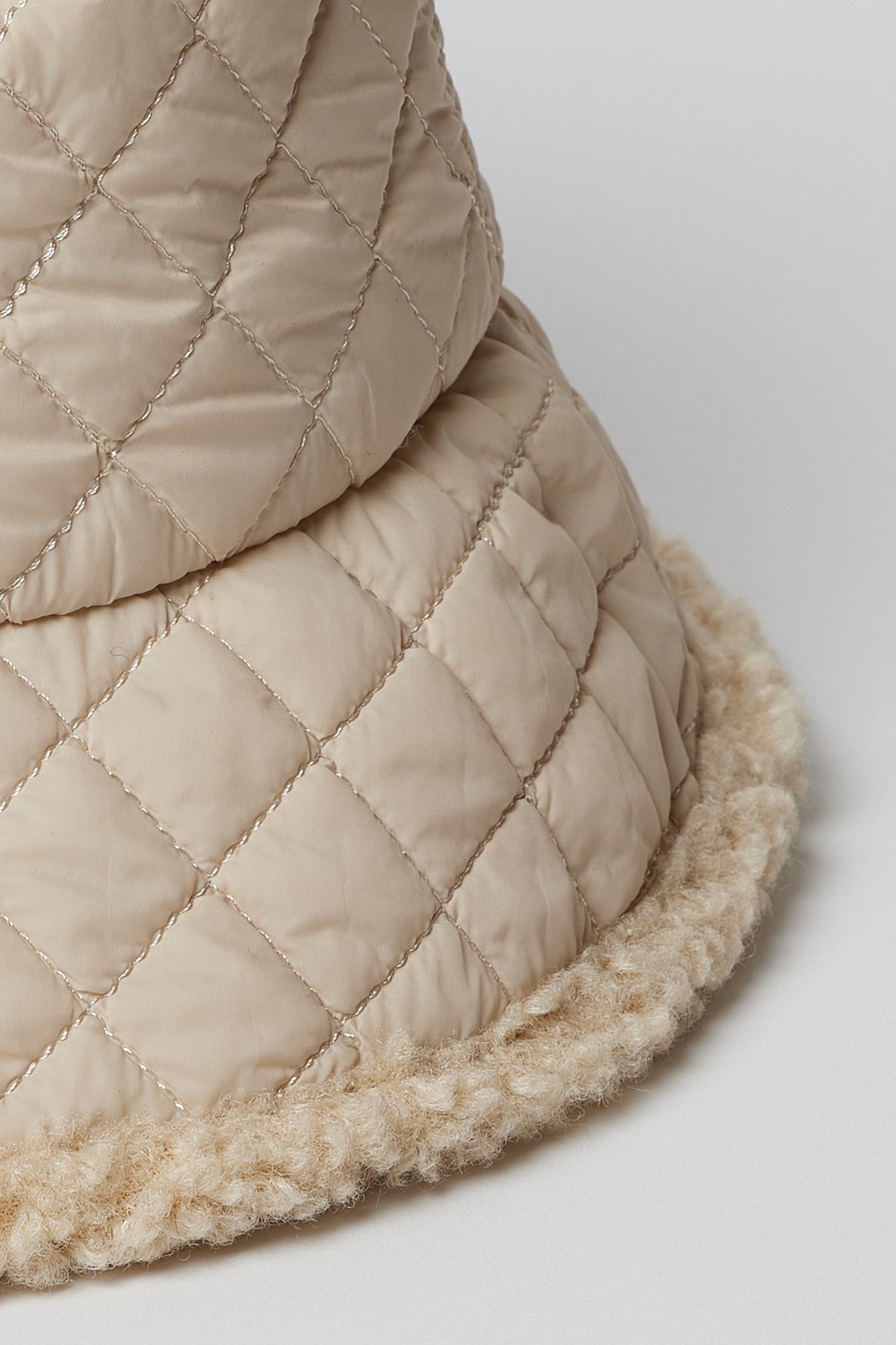 Detail of quilting and edge of ivory bucket hat-26749513531585