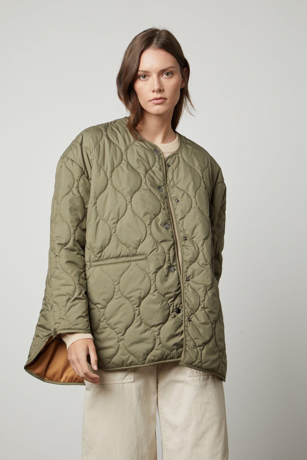 A woman wearing a Velvet by Graham & Spencer PAITYN QUILTED JACKET.-35655942799553