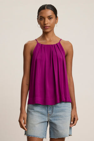 A person wears the Velvet by Graham & Spencer PIPER TANK TOP in magenta and light blue denim shorts, standing facing forward against a plain background.