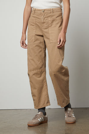 A woman wearing the Velvet by Graham & Spencer BRYLIE SANDED TWILL UTILITY PANT and white t-shirt.