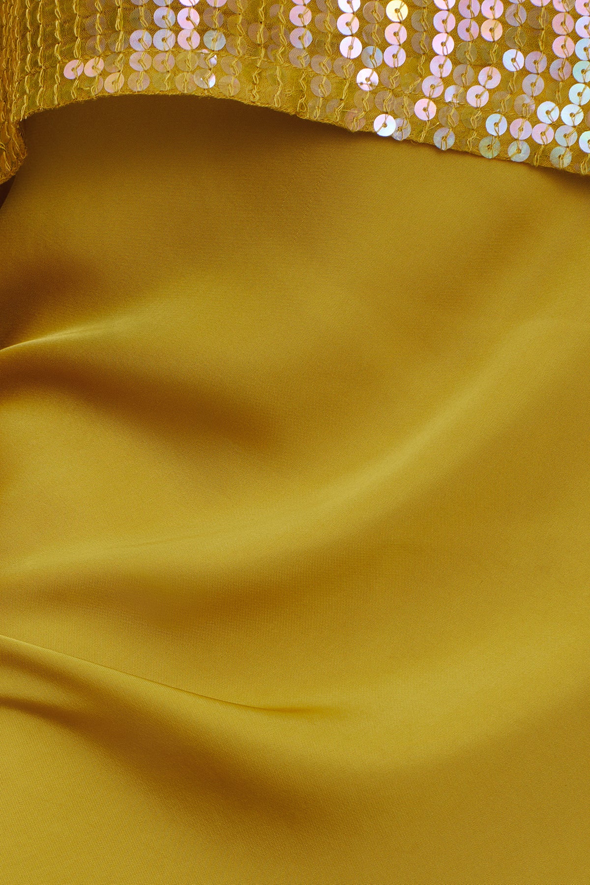 A close up of a Velvet by Graham & Spencer AUBREE SATIN MIDI SKIRT with sequins.-35577742164161