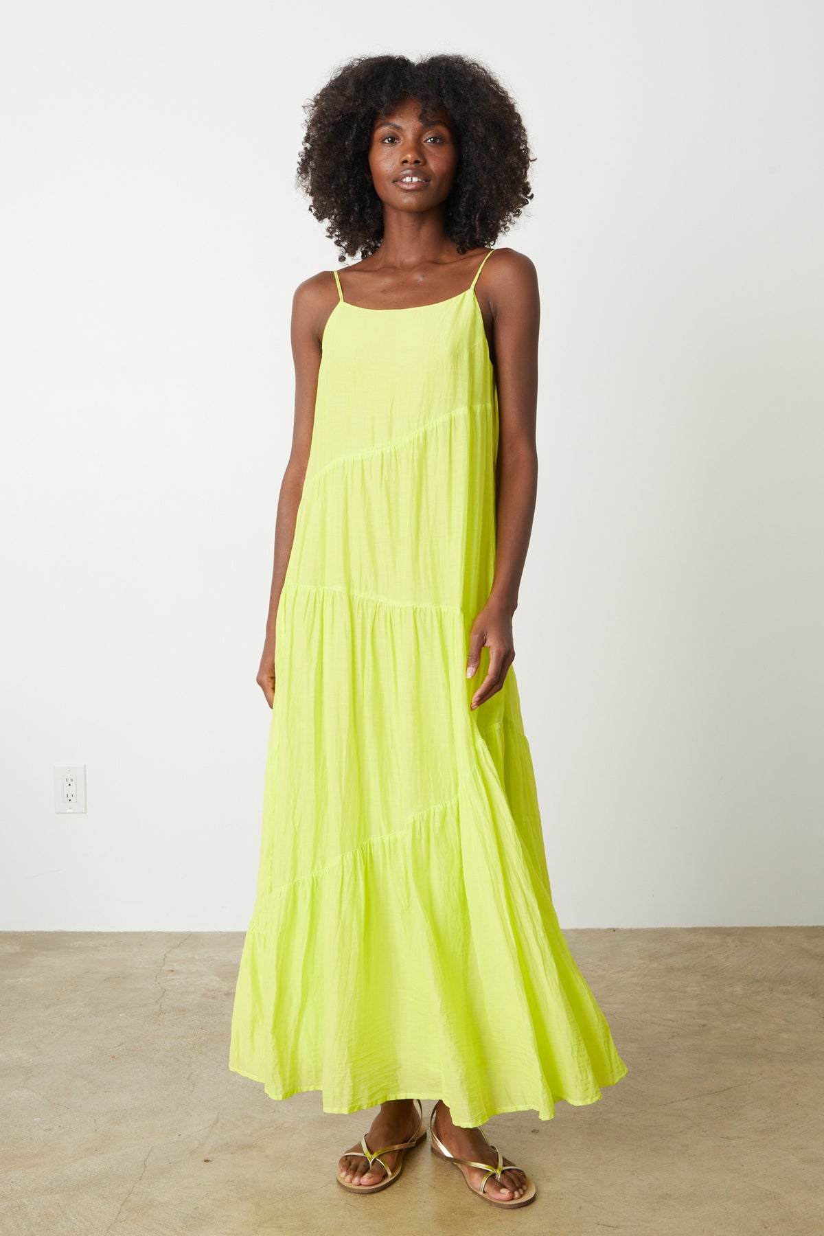 A model wearing a Velvet by Graham & Spencer BILLIE TIERED MAXI DRESS.